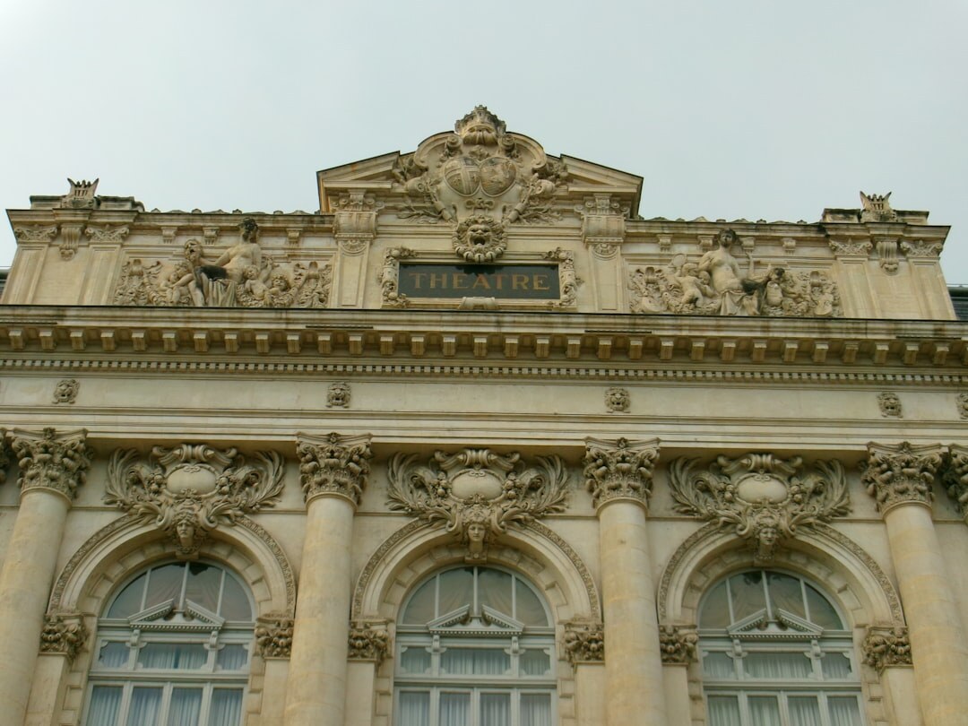 Elegant theatre facade illuminated at dusk