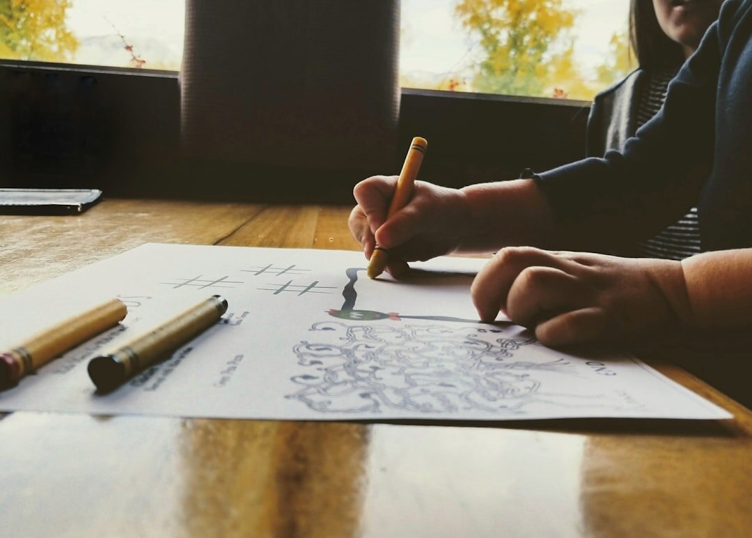 Editorial team reviewing layouts at a wooden table